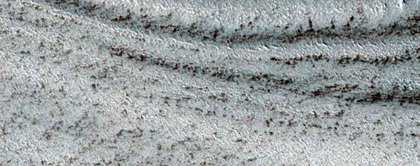 Exposure of Polar Layered Deposits on Ridges and Troughs