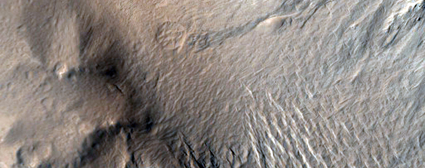 Dark Slope Streak Extending to Channel Floor
