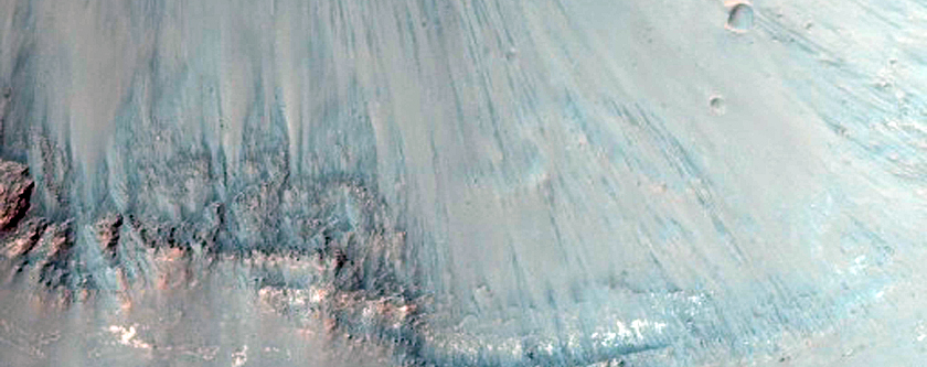 Light-Toned Layering along Floor of Small Trough Near Juventae Chasma