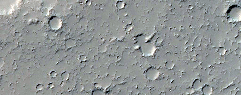 Lava Flow Spilling over Crater Wall onto Crater Floor in Daedalia Planum