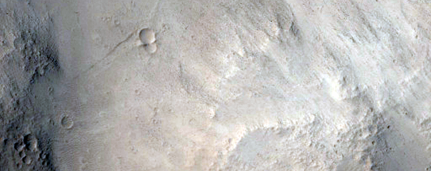 Impact Crater in the Tartarus Montes