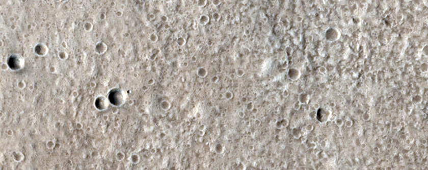 Crater Cluster Superimposed on Larger Crater on Alba Patera