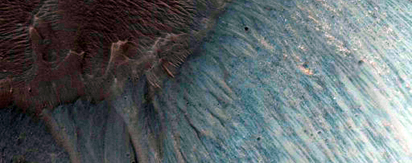 Light-Toned Layering along Floor of Small Trough Near Juventae Chasma