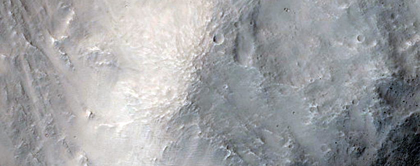 Recent Impact Crater on the Rim of a Much Larger Crater
