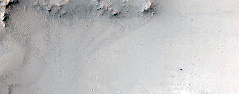 Small Valleys around Impact Crater in Syrtis Major Region