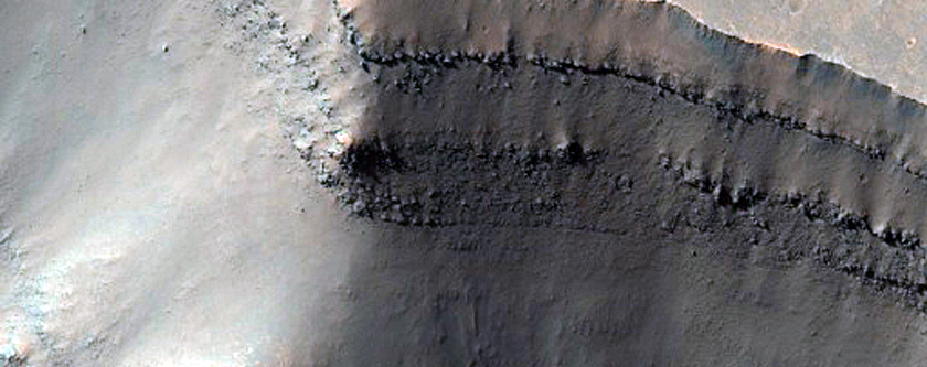 Rampart Crater Ejecta Exposed in Cross-Section