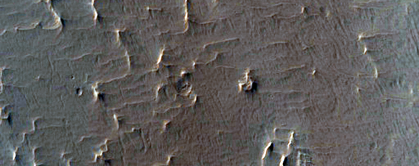 Pedestal Crater with Wind Streaks