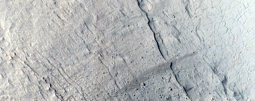 Layers on Pedestal Crater in Tikhonravov Crater