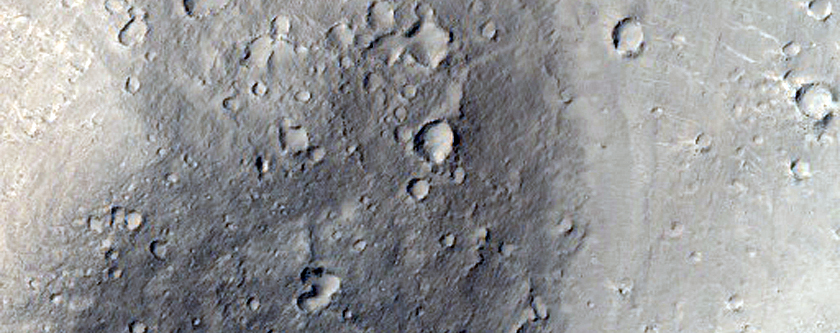 Isolated Hills with Debris Flow Aprons in Tartarus Montes