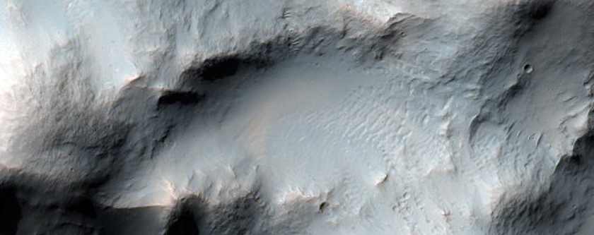 Impact Crater Exposing Bedrock