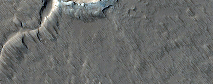 Faulted Shield Volcano with Summit Crater in Tharsis Region