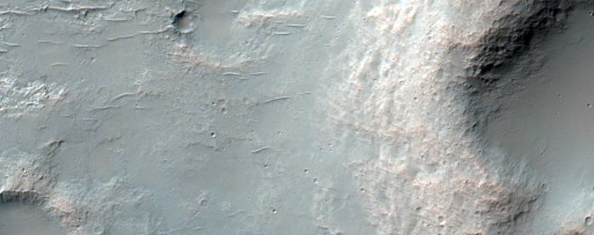 Mesas in Partly Exhumed Crater in Northeast Hellas Planitia