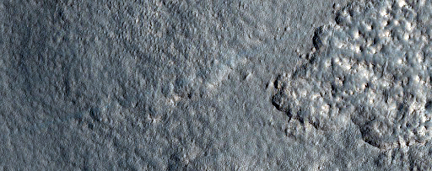 Mantling Material Near Milankovic Crater
