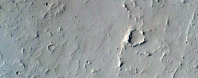 Impact Crater on Edge of Ceraunius Fossae