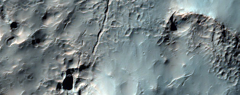 Crater Near Hale Crater Filled with Pitted and Fractured Material