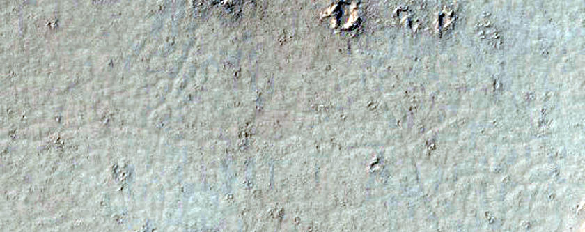 Flows and Terraces Overlapping Crater Ejecta South of Marte Vallis
