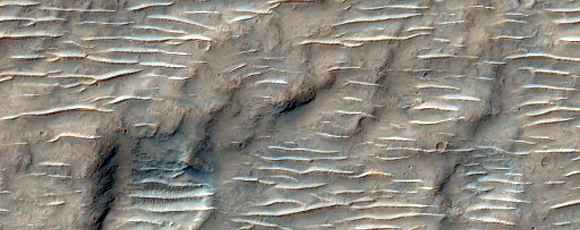 Embayed Crater Ejecta in Hesperia Planum