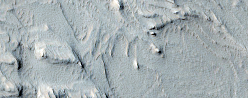 Stratified Material in the Gigas Fossae Region