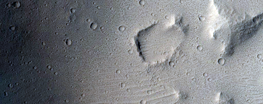 Preserved Crater on Streamlined Surface