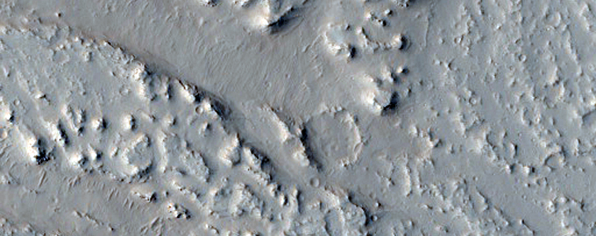 Platy Flows and Channels on the Tharsis Region