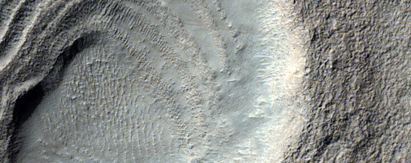Layered Deposits in Crater in Hellas Montes Region