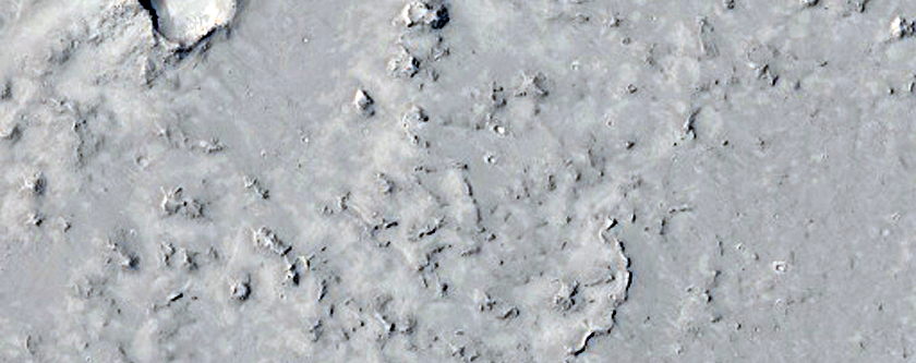 Cratered Cones with Divergent Wakes Near Grjota Valles