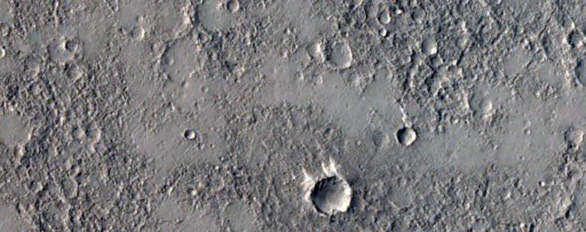 Distal and Degraded Ejecta From Crater in Isidis Planitia