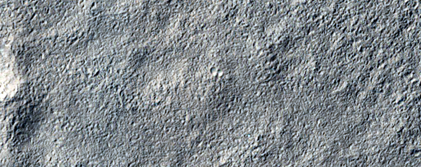 Layered Deposit in Small Craters Northeast of Reull Vallis