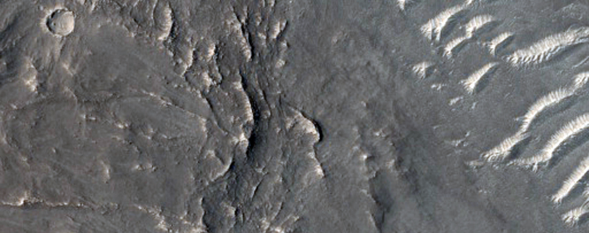 Layered Rocks on Floor of Large Ancient Crater