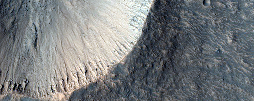 Fresh Crater Adjacent to Hephaestus Fossae