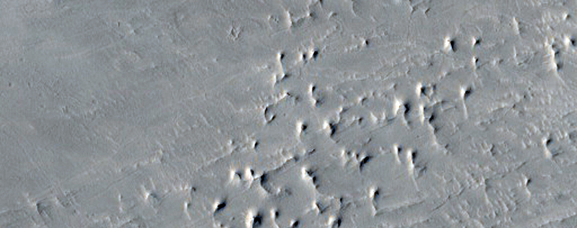 Faulted Layered Deposits in Capen Crater
