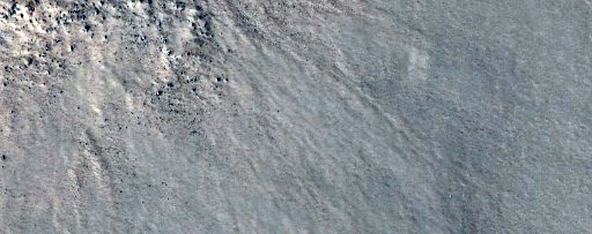 Small Fresh Crater over Icy Ground
