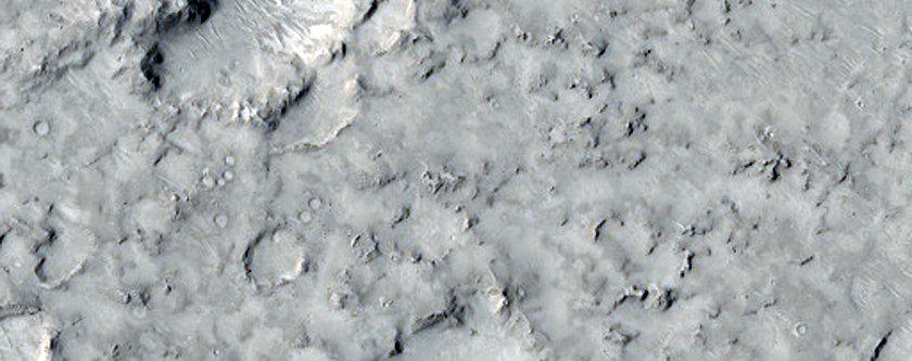 Cratered Cones with Divergent Wakes Near Grjota Valles
