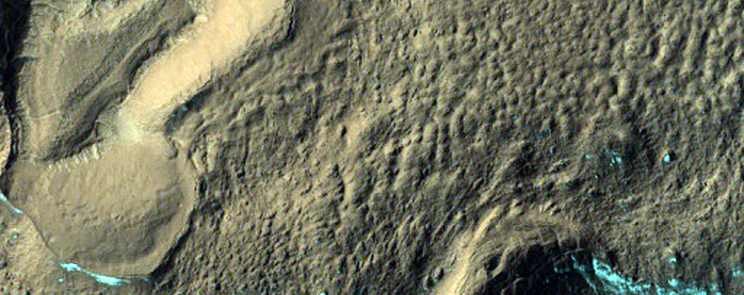 Large Ridges and Hollows in Crater East of Hellas Region
