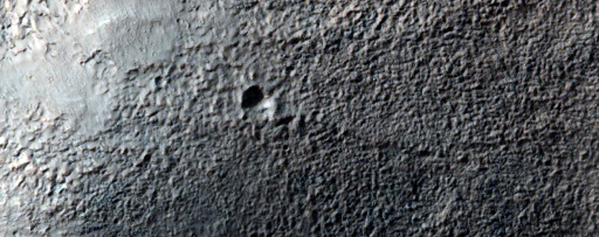 Small Crater on Rim of Hartwig Crater
