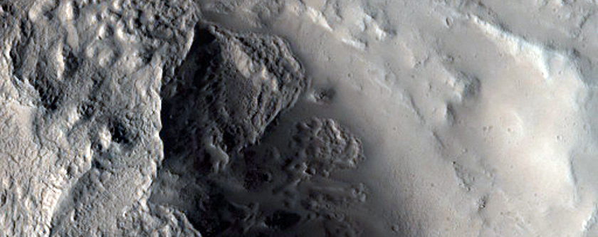 Fresh Crater Exposing Volcanic Layers
