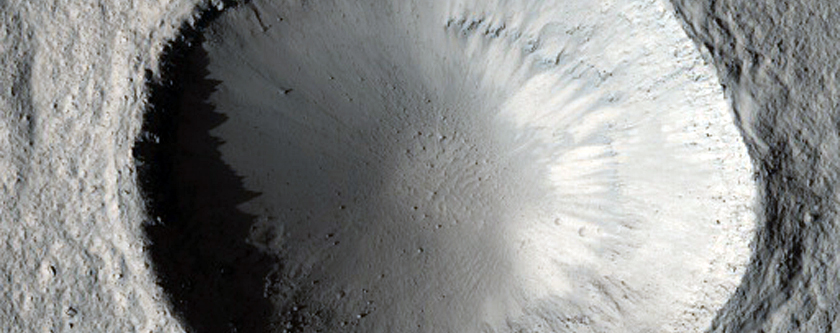 Pedestal Crater with Jagged Ejecta Margin
