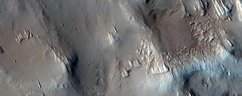Interaction between Pedestal Crater and Scarp
