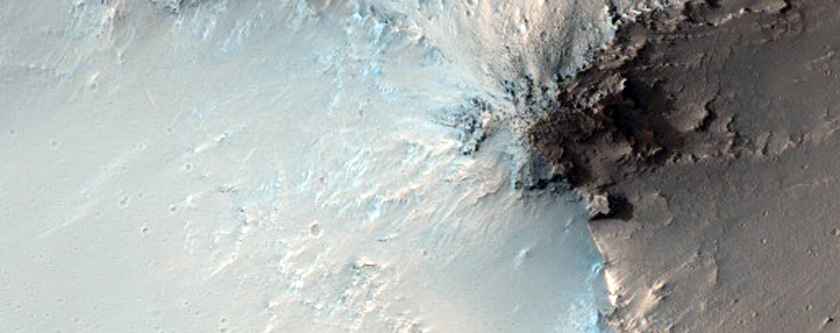 Dark Material on or in Crater Wall Associated with Intra-Crater Dunes
