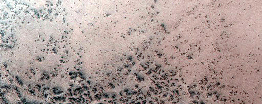 Crater with Central Peak Ring South of Thaumasia Fossae
