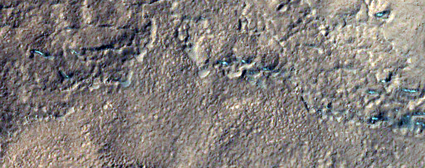 Hollowed Terrain along Mounds in Ejecta
