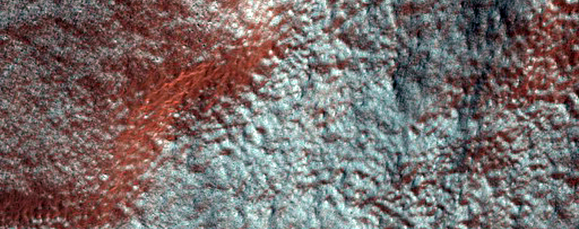 Modified Slopes of Tall Peaks along Southwest Rim of Hellas Planitia
