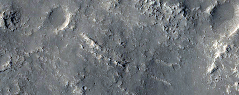 Craters Intersected by Mare-Type Ridges in Lunae Planum
