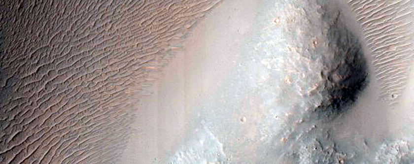 Impact Crater Exposing Bedrock
