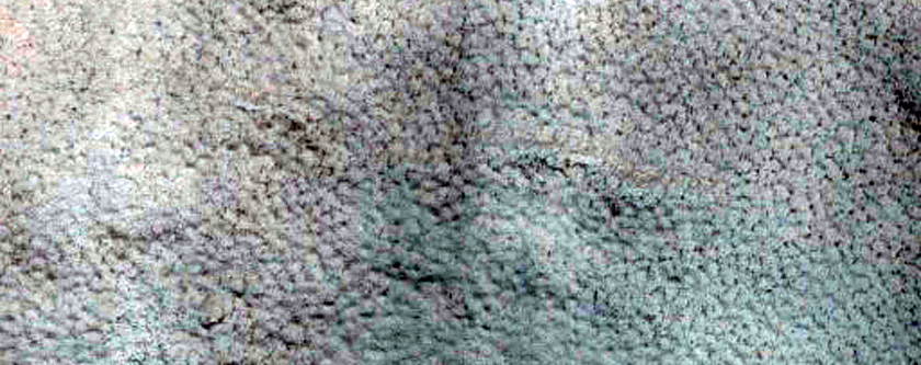 Transition from Uplands to Large Crater with Flow-Like Features along Rim
