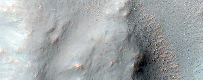 Seven Kilometer Crater with Good Exposures of Layered Bedrock
