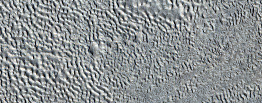 Crater and Ejecta Blanket Partly Covered by Mid-Latitude Apron
