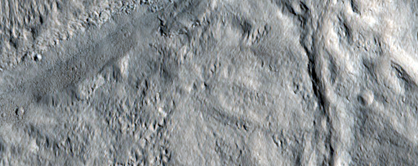 Ricochet Crater Formed from Elliptical Crater to the East
