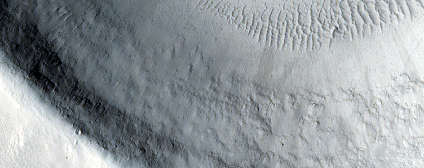 Flow Material on Floor of Crater with Rim Cut by Channel