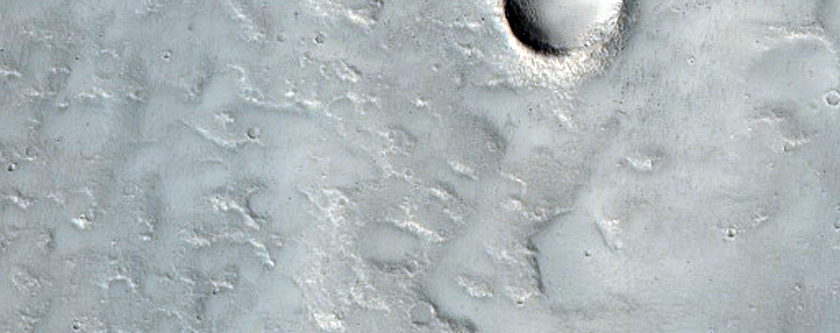 Small Valley on Sinuous Mound East of Hecates Tholus
